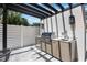 Outdoor kitchen featuring a built-in grill and sink, perfect for entertaining in a private backyard setting at 2596 Floyd St, Sarasota, FL 34239