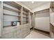 Custom walk-in closet with adjustable shelving, drawers, and ample storage space for organization at 2596 Floyd St, Sarasota, FL 34239