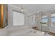 Luxurious bathroom with a soaking tub, a glass enclosed shower, and elegant fixtures at 2806 Starwood Ct, Lakewood Ranch, FL 34211