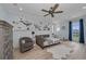 Stylish bedroom with a ceiling fan, light blue walls, and a unique nautical-themed wall decoration at 2806 Starwood Ct, Lakewood Ranch, FL 34211