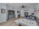 bedroom with cool, calming light blue walls and wood floors and gray furniture at 2806 Starwood Ct, Lakewood Ranch, FL 34211