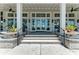 Inviting clubhouse entrance with elegant planters and glass doors at 2806 Starwood Ct, Lakewood Ranch, FL 34211