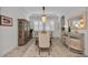 Sophisticated dining room featuring shuttered windows, elegant chandelier, and stylish furnishings at 2806 Starwood Ct, Lakewood Ranch, FL 34211
