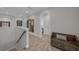 Second floor landing featuring hardwood floors and an arched entry to the bedrooms at 2806 Starwood Ct, Lakewood Ranch, FL 34211