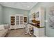 Inviting home office with built-in bookcases, desk, and comfortable seating at 2806 Starwood Ct, Lakewood Ranch, FL 34211