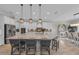 Bright kitchen boasts granite countertops, stainless steel appliances, and pendant lighting above the island at 2806 Starwood Ct, Lakewood Ranch, FL 34211