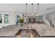 Kitchen island with an undermount sink, a large island, and views of the living area at 2806 Starwood Ct, Lakewood Ranch, FL 34211