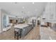 Well-lit kitchen island with bar seating, living area views, and modern appliances at 2806 Starwood Ct, Lakewood Ranch, FL 34211