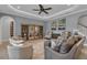 Spacious living room featuring neutral tones, tile floors, and stylish decor at 2806 Starwood Ct, Lakewood Ranch, FL 34211