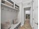 Convenient mud room with built-in bench seating, storage and access to the laundry room at 2806 Starwood Ct, Lakewood Ranch, FL 34211