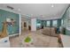 Spacious playroom with plush carpets, recessed lighting, ceiling fan and windows overlooking the neighborhood at 2806 Starwood Ct, Lakewood Ranch, FL 34211