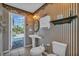 Bathroom featuring poolside access and unique decorations at 2816 88Th E Ave, Parrish, FL 34219