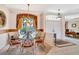 Elegant dining area featuring a glass table, ornate chairs, and a picturesque window view, perfect for entertaining guests at 2816 88Th E Ave, Parrish, FL 34219
