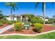 Charming home showcasing tropical landscaping and a welcoming entryway, blending curb appeal with comfort at 2816 88Th E Ave, Parrish, FL 34219