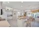 Bright kitchen with tiled floors, a breakfast bar, and a dining area overlooking the pool at 2816 88Th E Ave, Parrish, FL 34219