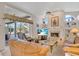 Inviting living room with a fireplace, built-in shelves, and views of the outdoor pool area at 2816 88Th E Ave, Parrish, FL 34219