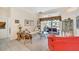 Bright living room with tile floors, comfortable seating, and large windows offering scenic views of the outdoors at 2816 88Th E Ave, Parrish, FL 34219