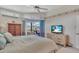 Relaxing main bedroom featuring floral accents, a TV, and views of the outdoor pool area at 2816 88Th E Ave, Parrish, FL 34219