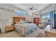 Comfortable main bedroom with a ceiling fan, natural light, and coordinated decor at 2816 88Th E Ave, Parrish, FL 34219