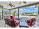 Covered patio offering comfortable seating and views of the pool and lake at 2816 88Th E Ave, Parrish, FL 34219