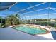 Relaxing screened pool area with a picturesque view of the lake and lush greenery, perfect for outdoor enjoyment at 2816 88Th E Ave, Parrish, FL 34219
