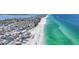 Beautiful aerial view of homes near beach with clear water and white sand, perfect for seaside living at 2918 Avenue E, Holmes Beach, FL 34217