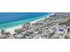 Stunning aerial view of a coastal community with turquoise water and beautiful beaches at 2918 Avenue E, Holmes Beach, FL 34217