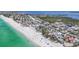 Breathtaking aerial view showcasing the beachfront homes, white sand and tranquil turquoise ocean at 2918 Avenue E, Holmes Beach, FL 34217
