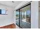 Bedroom balcony with sliding door, hardwood floor and natural light at 2918 Avenue E, Holmes Beach, FL 34217