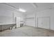 Large, unfinished basement with white walls, concrete floor, and ample space for storage or customization at 2918 Avenue E, Holmes Beach, FL 34217