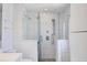 Modern bathroom featuring a glass-enclosed shower with dual shower heads and attractive tile work at 2918 Avenue E, Holmes Beach, FL 34217