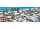Stunning aerial view of beachfront homes with lush tropical landscaping and breathtaking ocean views at 2918 Avenue E, Holmes Beach, FL 34217