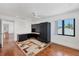 Bedroom with built-in desk and shelving, ample natural light, and ceiling fan at 2918 Avenue E, Holmes Beach, FL 34217