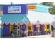 Quirky cafe exterior with vibrant colors, outdoor seating, and charming coastal decor at 2918 Avenue E, Holmes Beach, FL 34217