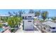 Modern three-story home boasting beach access and parking garage at 2918 Avenue E, Holmes Beach, FL 34217