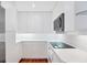 Bright kitchen featuring white cabinets and stainless steel appliances at 2918 Avenue E, Holmes Beach, FL 34217