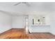Spacious living room with hardwood floors and kitchen access at 2918 Avenue E, Holmes Beach, FL 34217