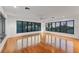 Bright living room featuring hardwood floors, large windows, and ample natural light at 2918 Avenue E, Holmes Beach, FL 34217