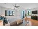 Large main bedroom featuring natural light, a ceiling fan, and balcony access at 2918 Avenue E, Holmes Beach, FL 34217