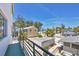 Charming neighborhood view of homes, palm trees and the beach under a sunny blue sky at 2918 Avenue E, Holmes Beach, FL 34217