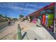 Picturesque street scene with shops, sidewalks, and cyclists, capturing the essence of a charming coastal community at 2918 Avenue E, Holmes Beach, FL 34217