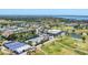 Wide aerial shot of the community showcasing amenities such as tennis courts, swimming pool, and well-kept grounds at 3007 Live Oak Ln, Palmetto, FL 34221