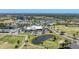 Aerial view of the community clubhouse, swimming pool, and golf course near attractive residential buildings at 3007 Live Oak Ln, Palmetto, FL 34221