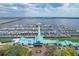 Aerial view of a marina featuring a variety of boats, a waterfront restaurant, and scenic water views at 3007 Live Oak Ln, Palmetto, FL 34221