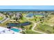 Beautiful aerial view of the community with the golf course, lakes, and residential area overlooking the water at 3007 Live Oak Ln, Palmetto, FL 34221