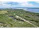 Picturesque aerial view of Emerson Point Preserve, displaying winding trails, serene ponds, and coastal scenery at 3007 Live Oak Ln, Palmetto, FL 34221