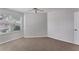 Bedroom with neutral carpet and lots of natural light from the window at 3007 Live Oak Ln, Palmetto, FL 34221