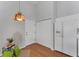 Entryway features wood-look floors, closet, and bright hanging light fixture at 3007 Live Oak Ln, Palmetto, FL 34221