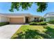 Charming single-story home with a well-manicured lawn and attached two-car garage, exuding curb appeal at 3007 Live Oak Ln, Palmetto, FL 34221