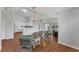 Open-concept living space blending the living, dining, and kitchen areas with hardwood floors at 3007 Live Oak Ln, Palmetto, FL 34221